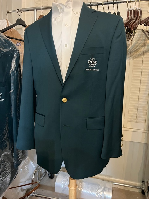 Dark green custom blazer with logo on the chest pocket 